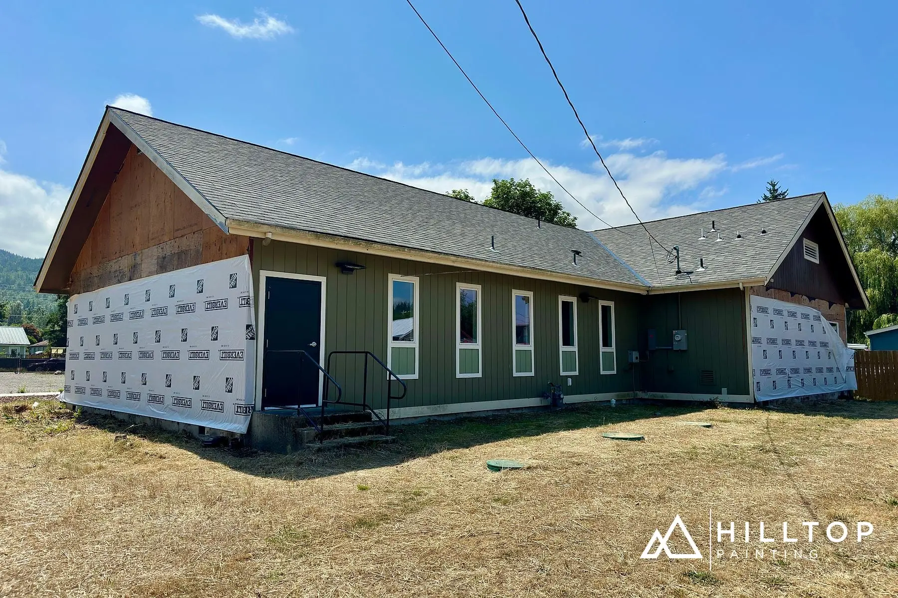 Re-Sided, Repaired & Repainted — a Deming Commercial Building in Sage Green — photo 7
