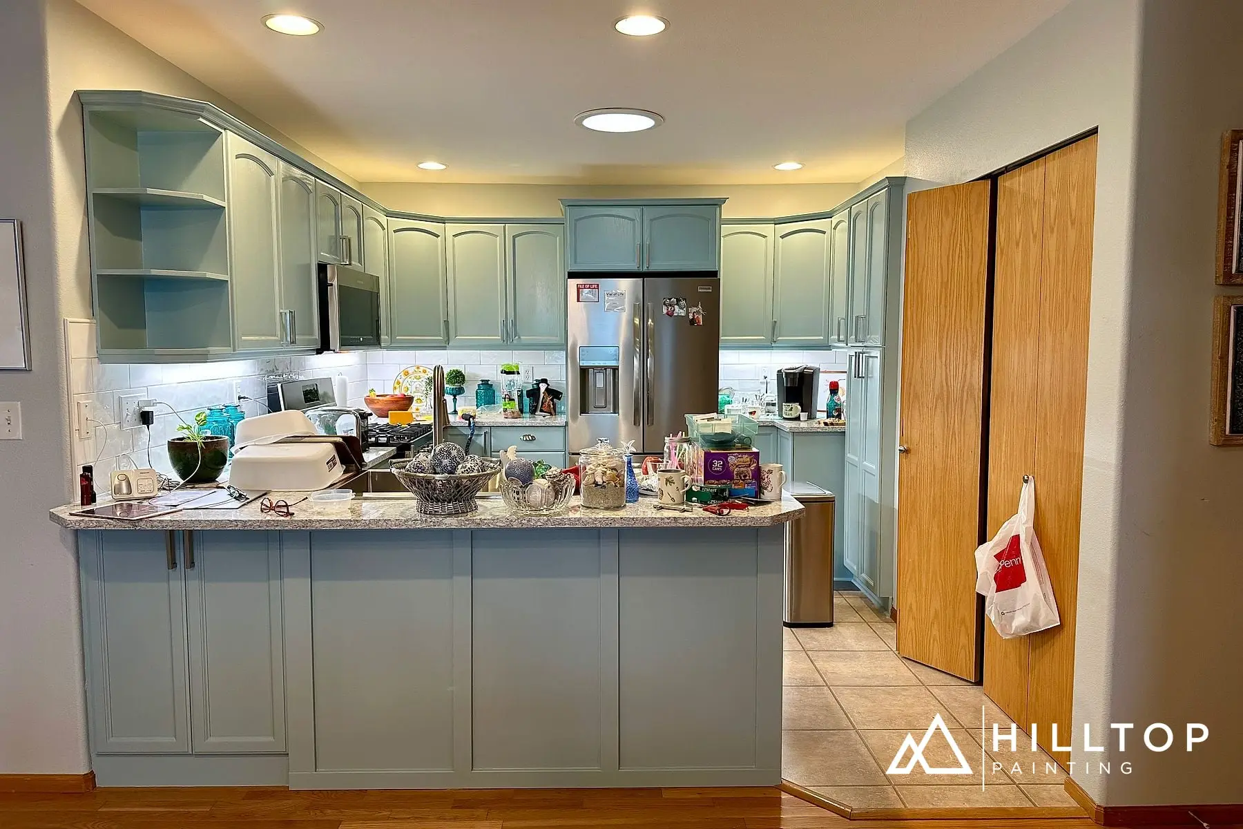 After: Golden Oak to a Soft Blue-Green — a 35-Door Bellingham Cabinet Repaint
