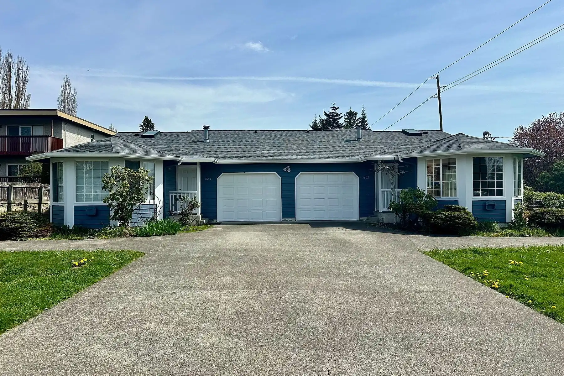Carpenter repairing exterior trim on a Bellingham home
