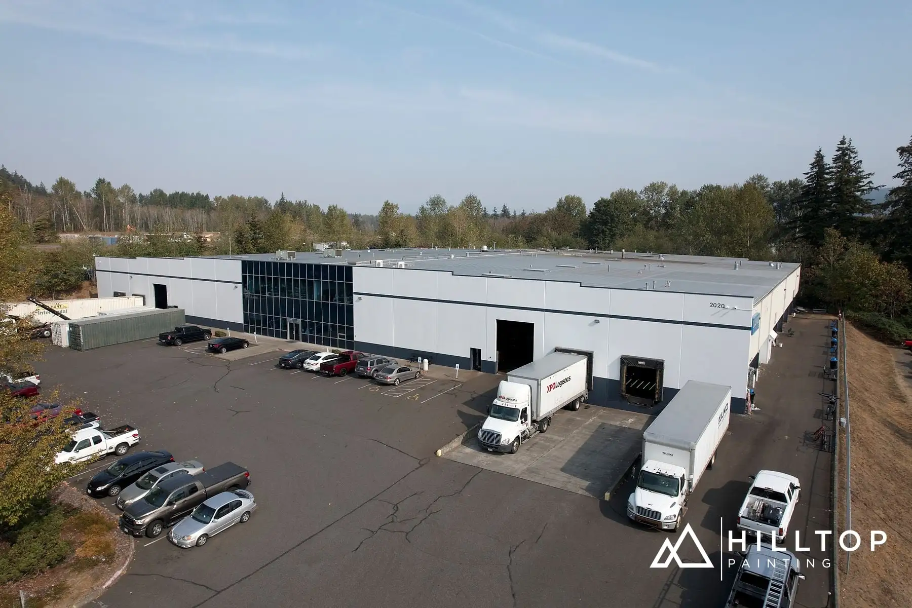 The LKQ Warehouse off Bakerview — a Boom-Lift Repaint in Two Colors